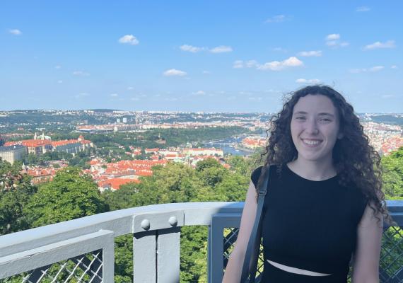 Anna Lowrance standing in front of a view of Prague