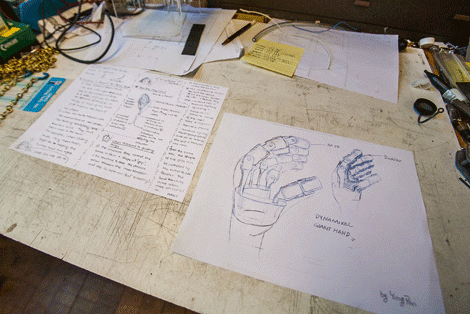 drawings of a robotic hand on a table