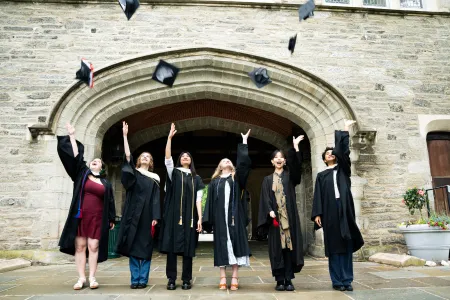 Students throwing caps in the air