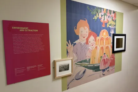 Wall display with colorful image of children looking at a Jell-O dessert and a large label that reads Environment and Extraction 