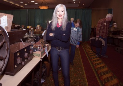 Barbara Kevles standing near vintage equipment