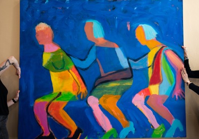 A painting by Katherine Bradford ’64 is installed in the Campus Center.