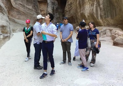 Students at the Siq, the entrance to the ancient city of Petra.