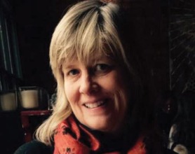 Portrait of Tracey Ohaus on a black background