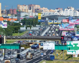 Image of a busy road in Russia with billboards on all sides