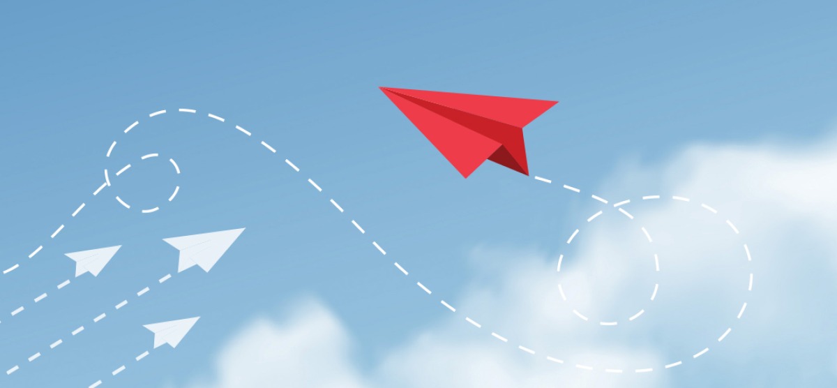 Illustration of paper airplanes, three going in one direction and a fourth going in a different one