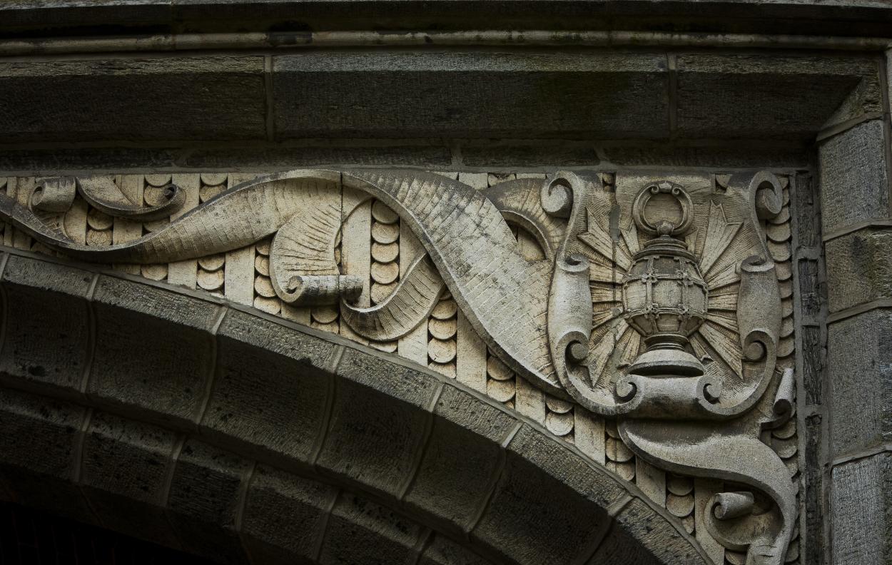 carving of lantern in archway