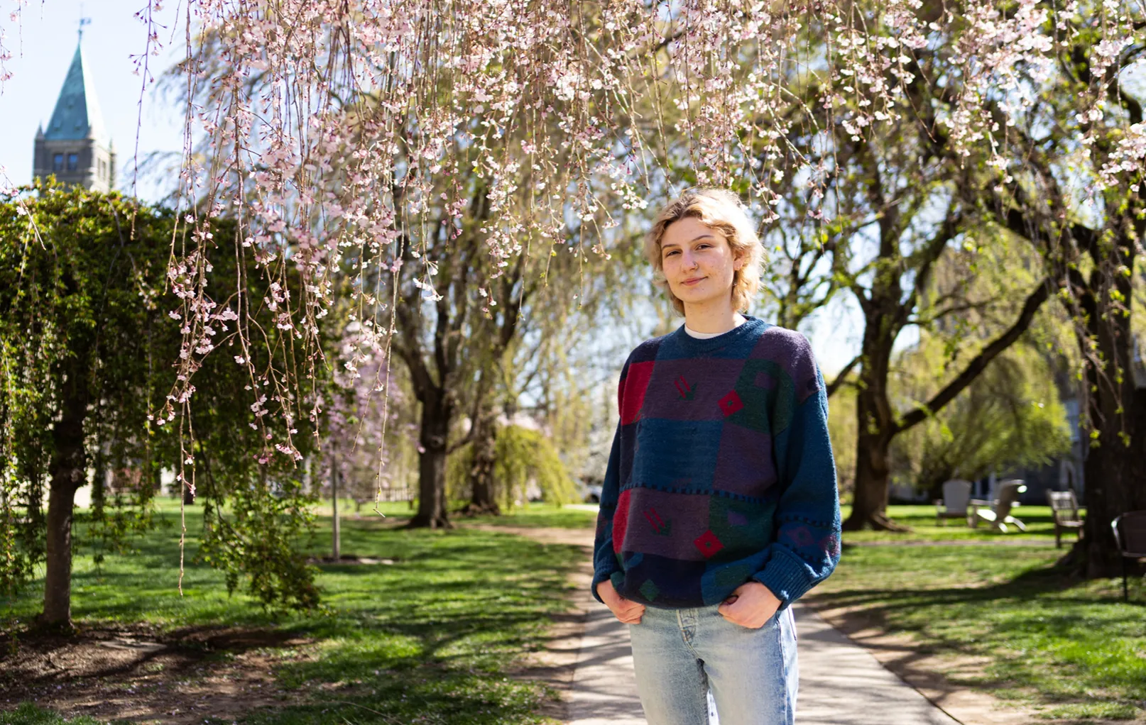 Charli Parsons '25 under the cherry blossom trees, stem research alumni