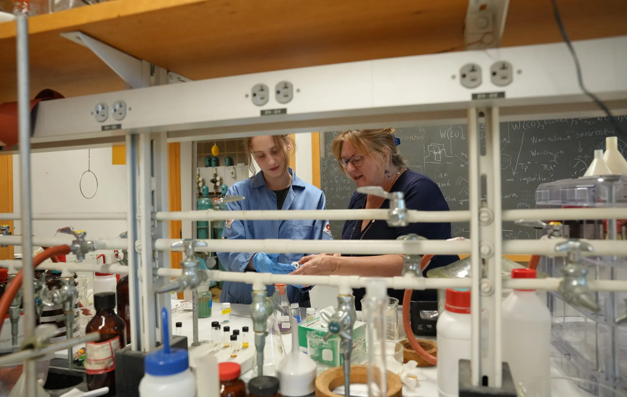 student and faculty in lab