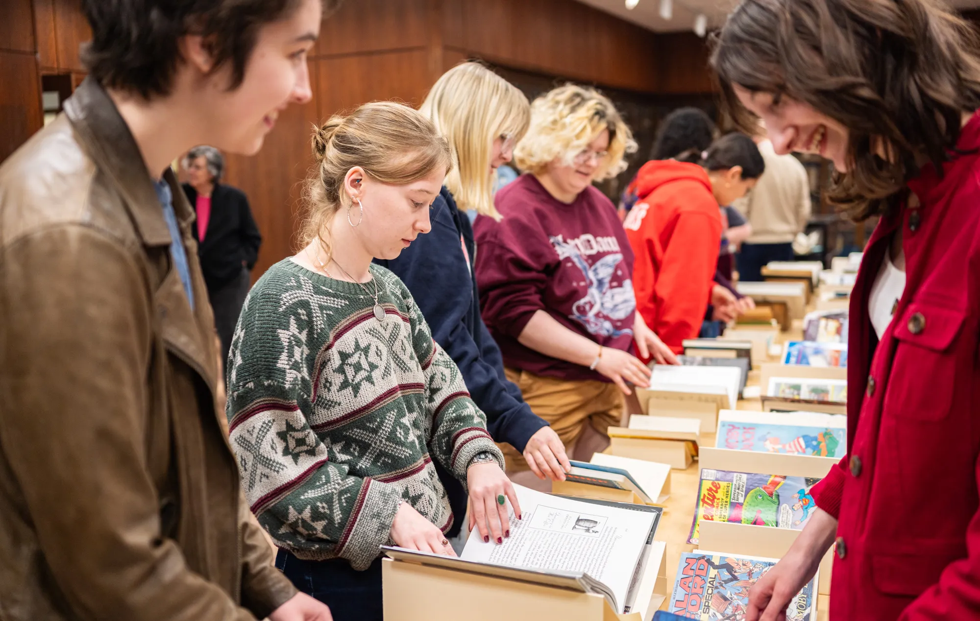 Students looking at books in special collections