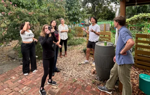 Photo of Students standing outside.