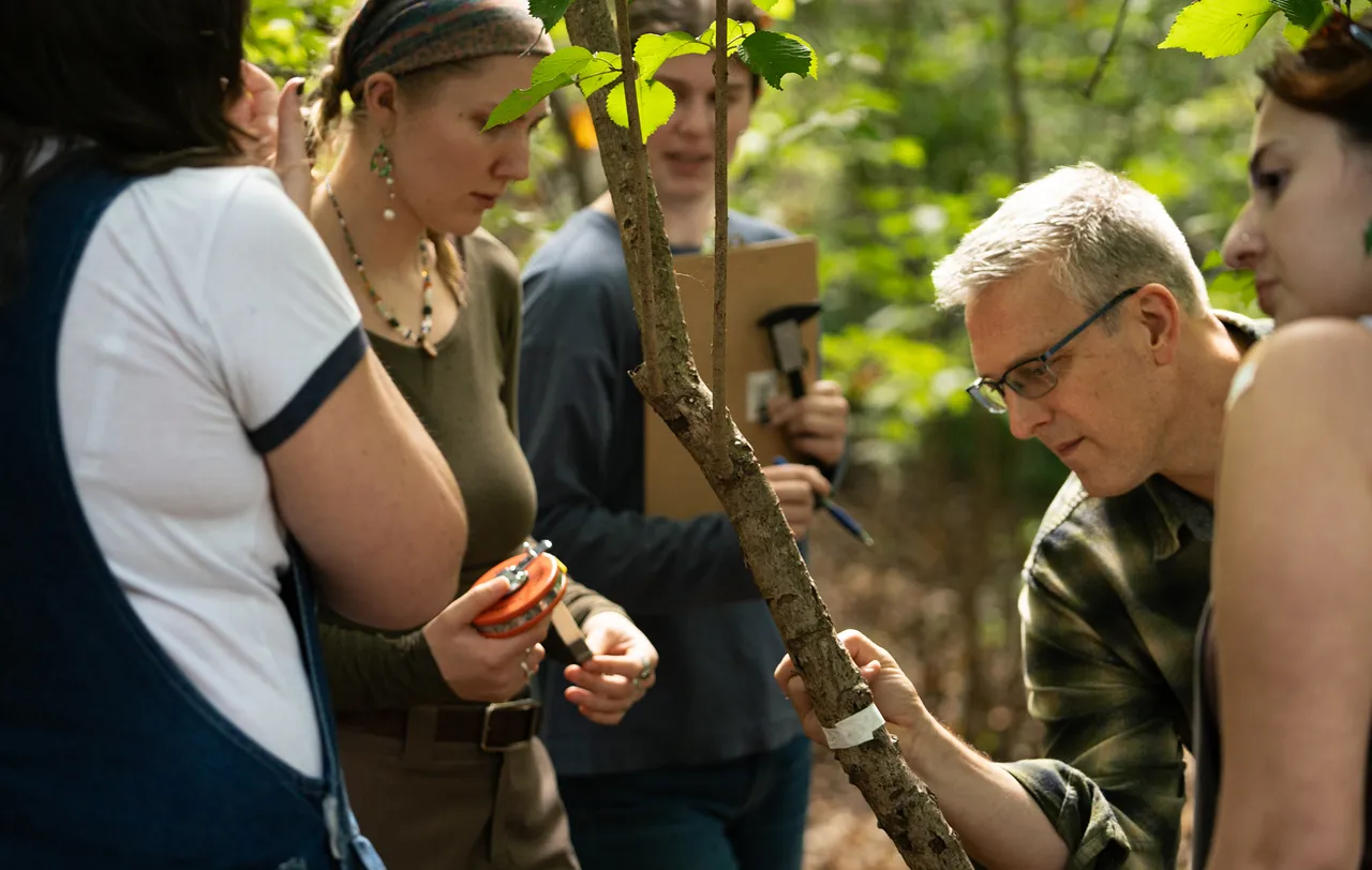 Mozdzer and students in the field doing research