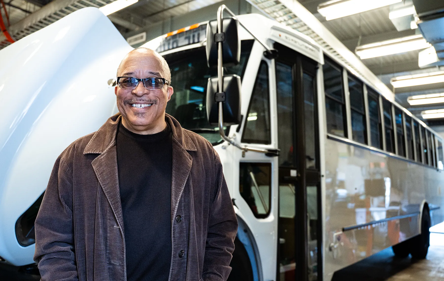 Steve Green in front of Blue Bus