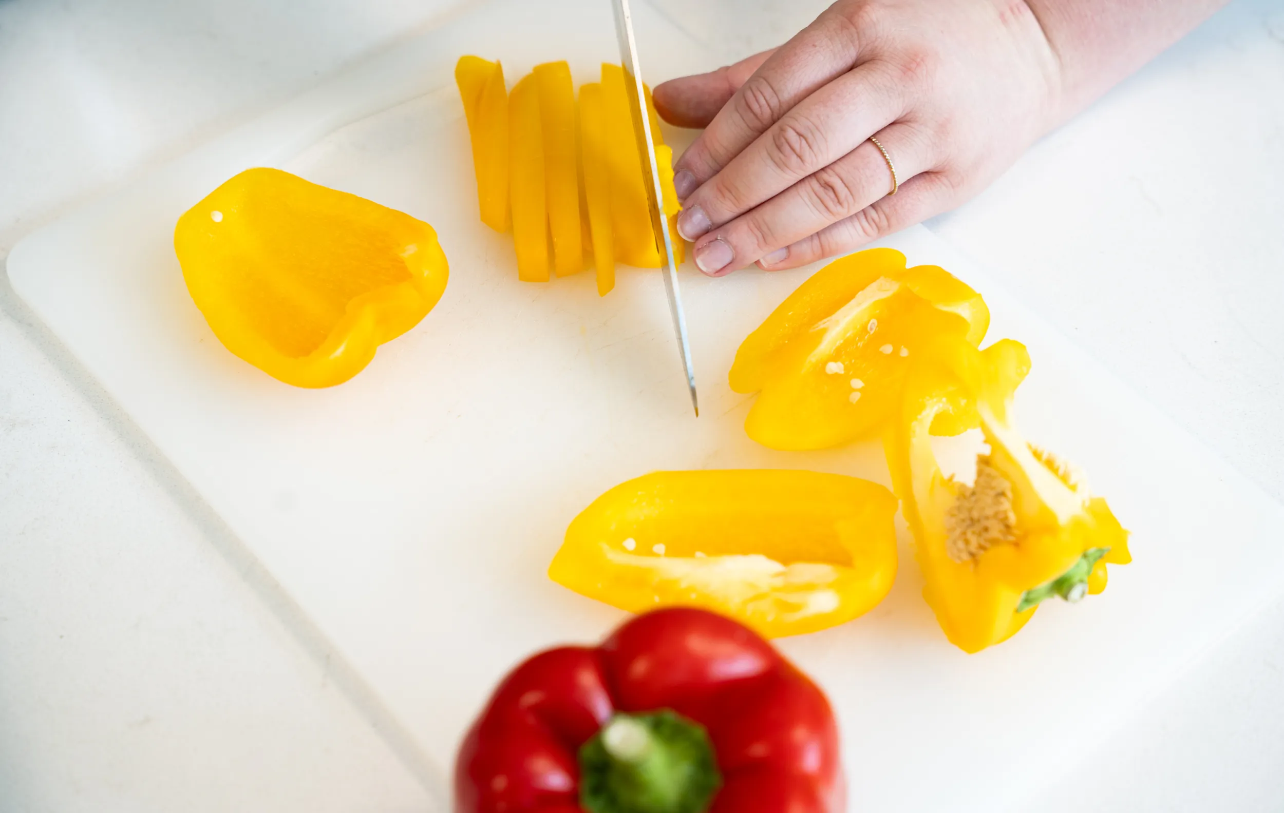 Fresh bell peppers being prepared for Bryn Mawr College campus dining.