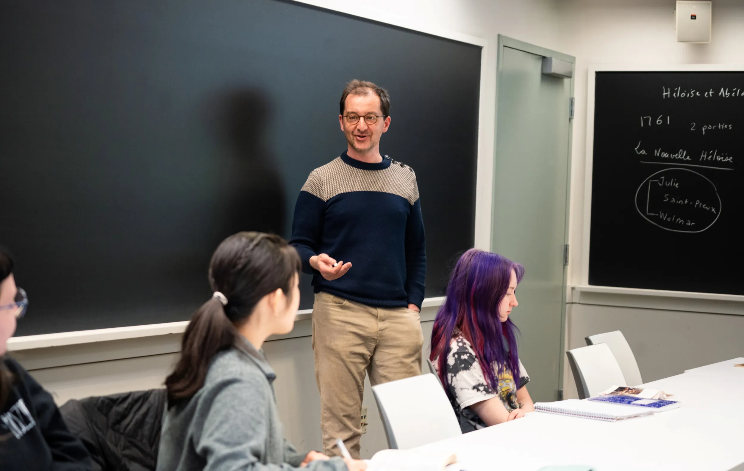 Rudy sharing his faculty research during class
