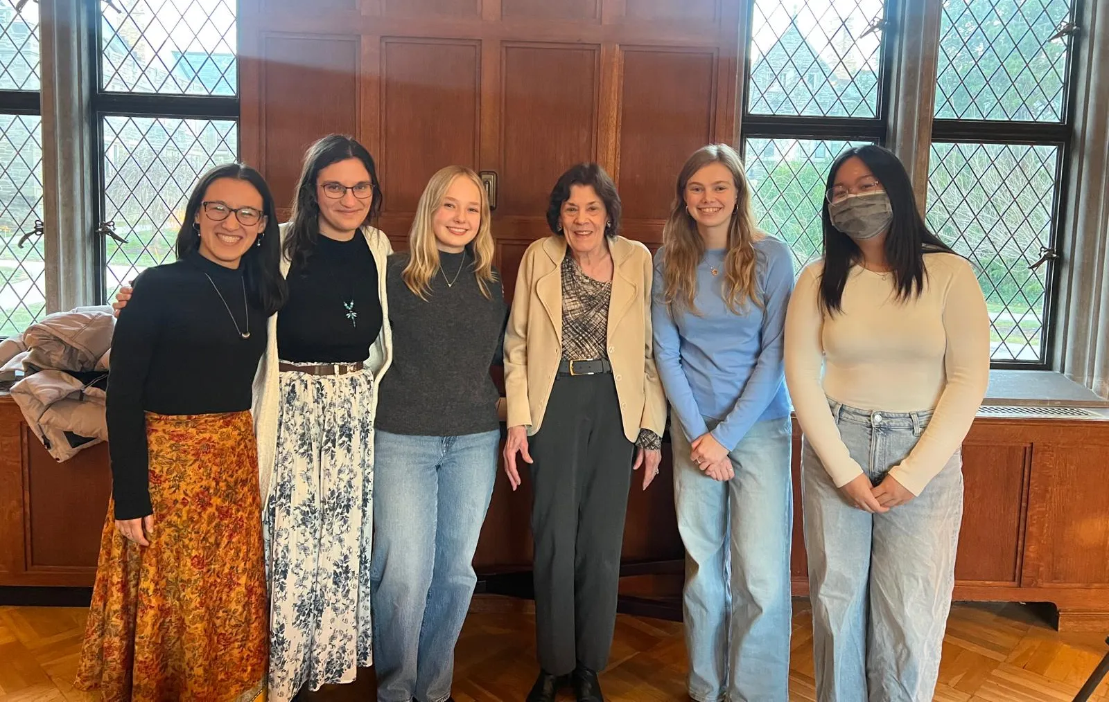 Five students and a professor in Old Library