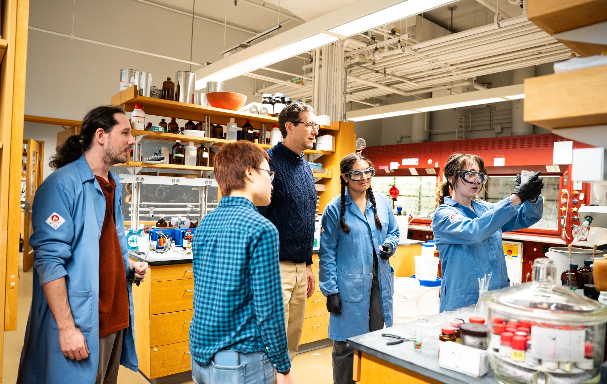 Professor Malachowski and organic chemistry students work in a lab