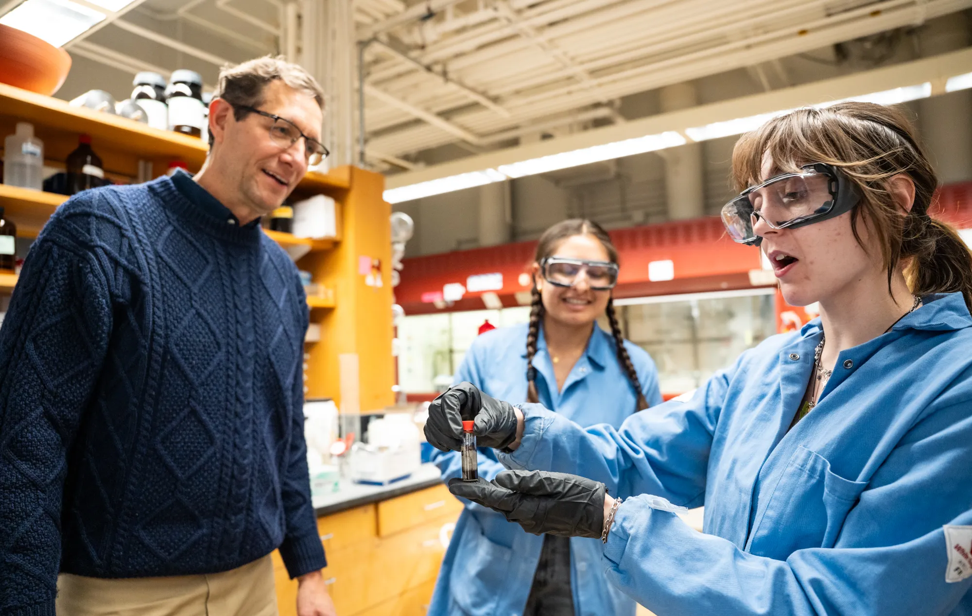 Two students of molecular biology and biochemistry work developing therapeutics in the malachowski lab