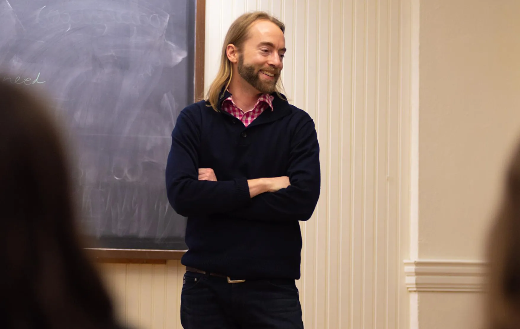 Joel Schlosser in classroom, engaging in research with students