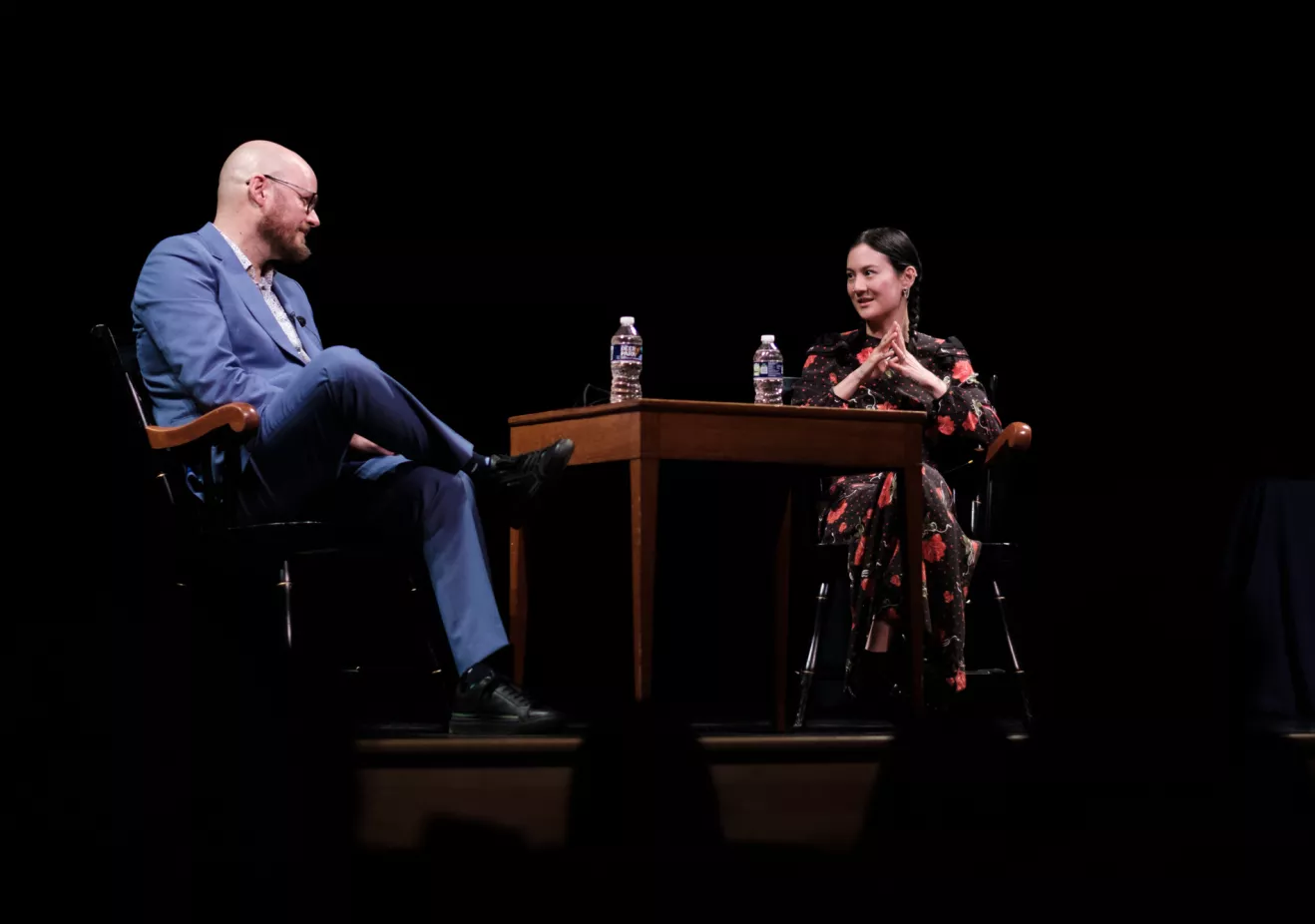 Michelle Zauner '11 (right) and Professor Daniel Torday on stage at Goodhart Hall.