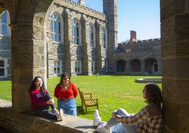 Students sitting and talking in the Cloisters