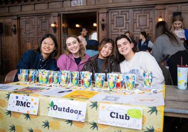 Four students advertising outdoor club