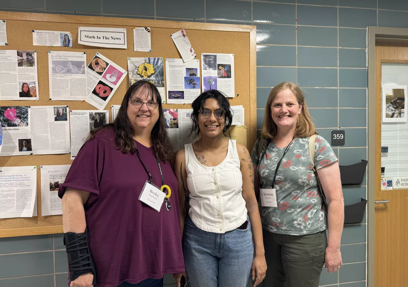 phd math alumnae posing in the hallway