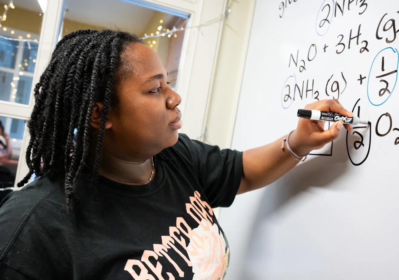 Student at Quantitative Center whiteboard
