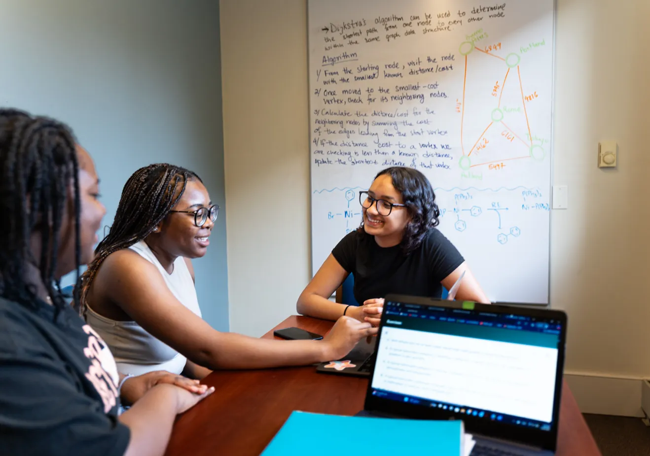 Three students at Quantitative Center table
