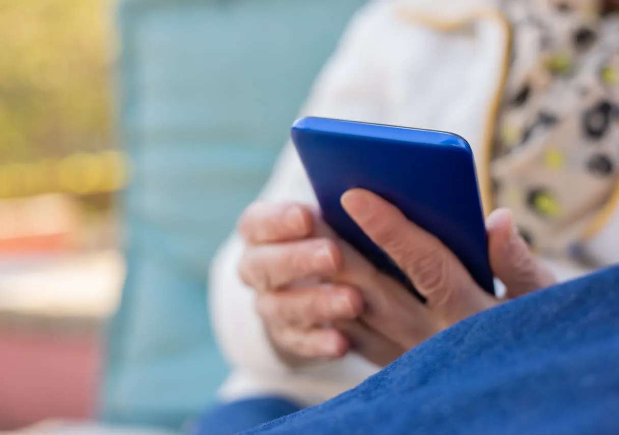 Holding blue phone in hands