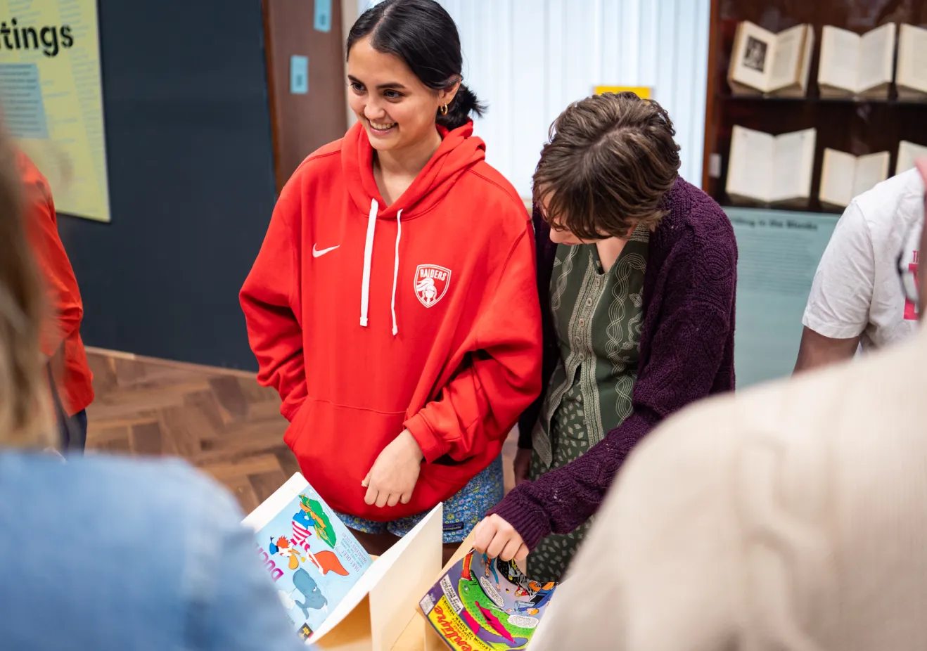 Students look at books in special collections