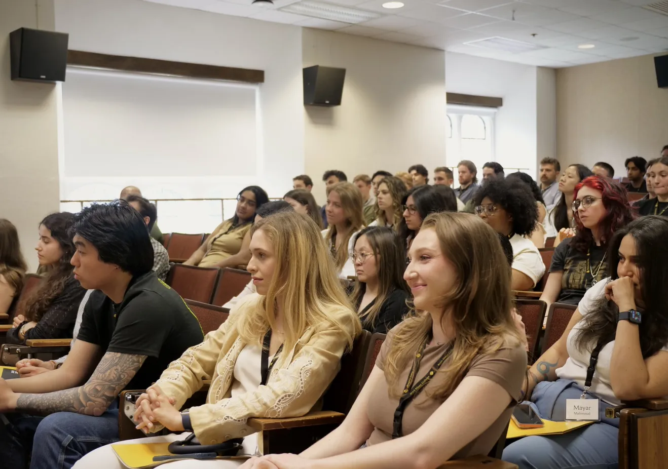 Students sitting in lecture hall for Postbac Orientation
