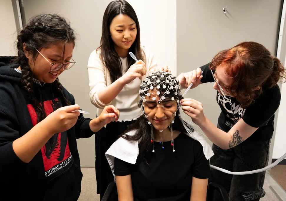 students applying an EEG