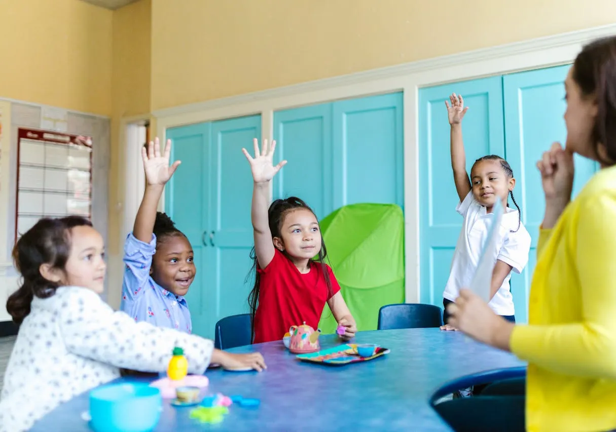 Kindergarten Students Raising Hands