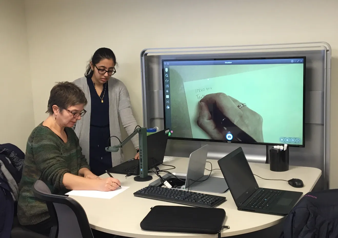 Staff assisting faculty with educational technology