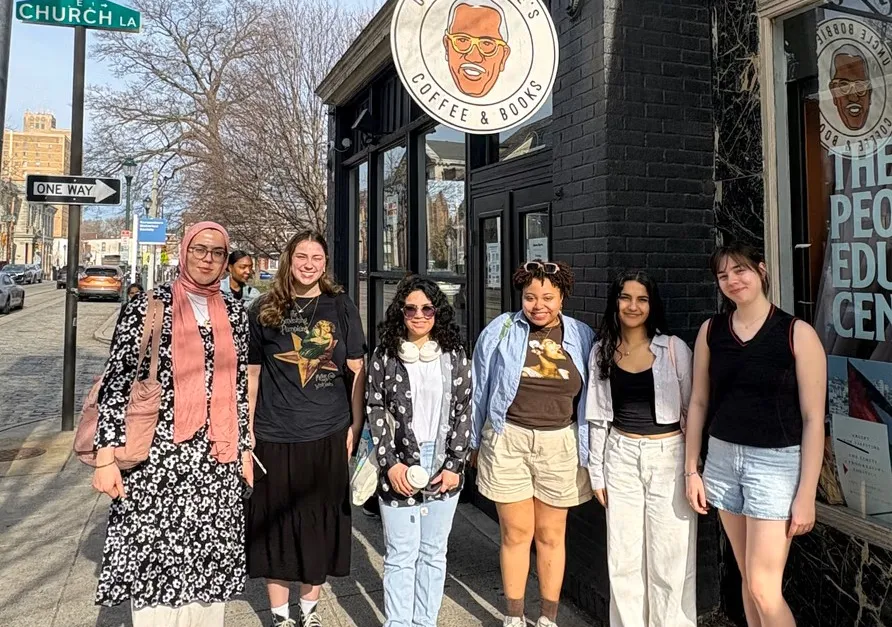 students out front of a bookstore