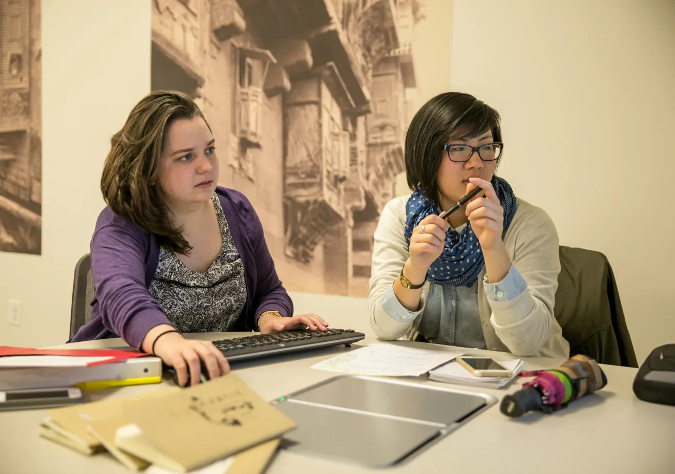 Two students look at a computer