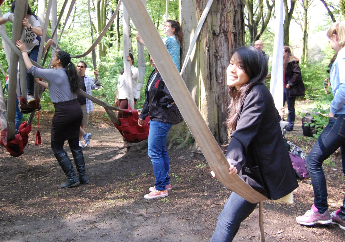 Bryn Mawr College German and German Studies Students sitting on swings of natural materials in Germany's green city