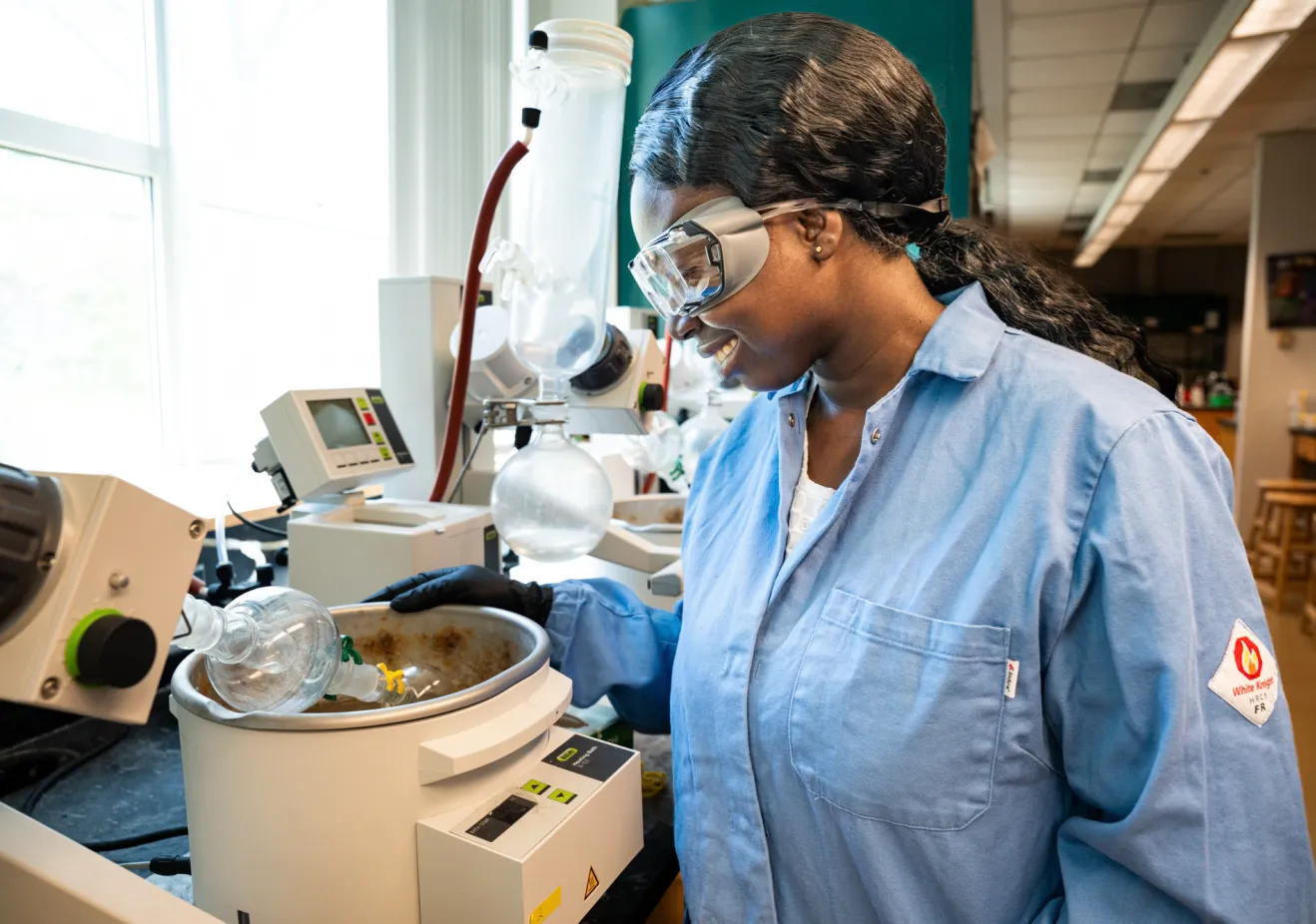 chemistry graduate student doing lab work