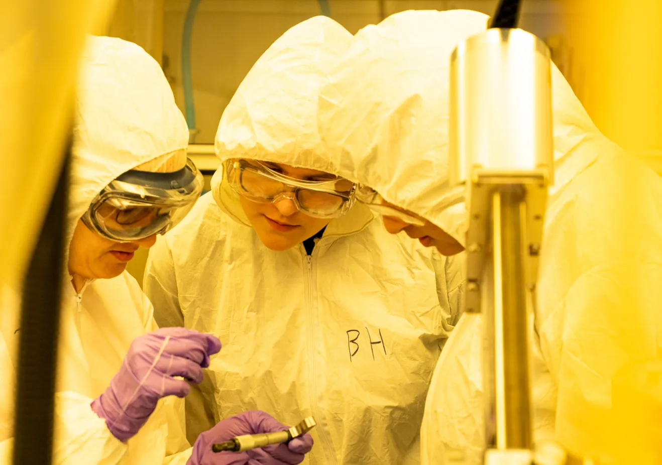 physics graduate students doing lab work