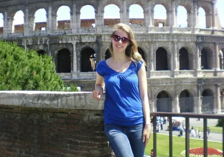 A Bryn Mawr student studying abroad in Italy poses in front of the Colosseum