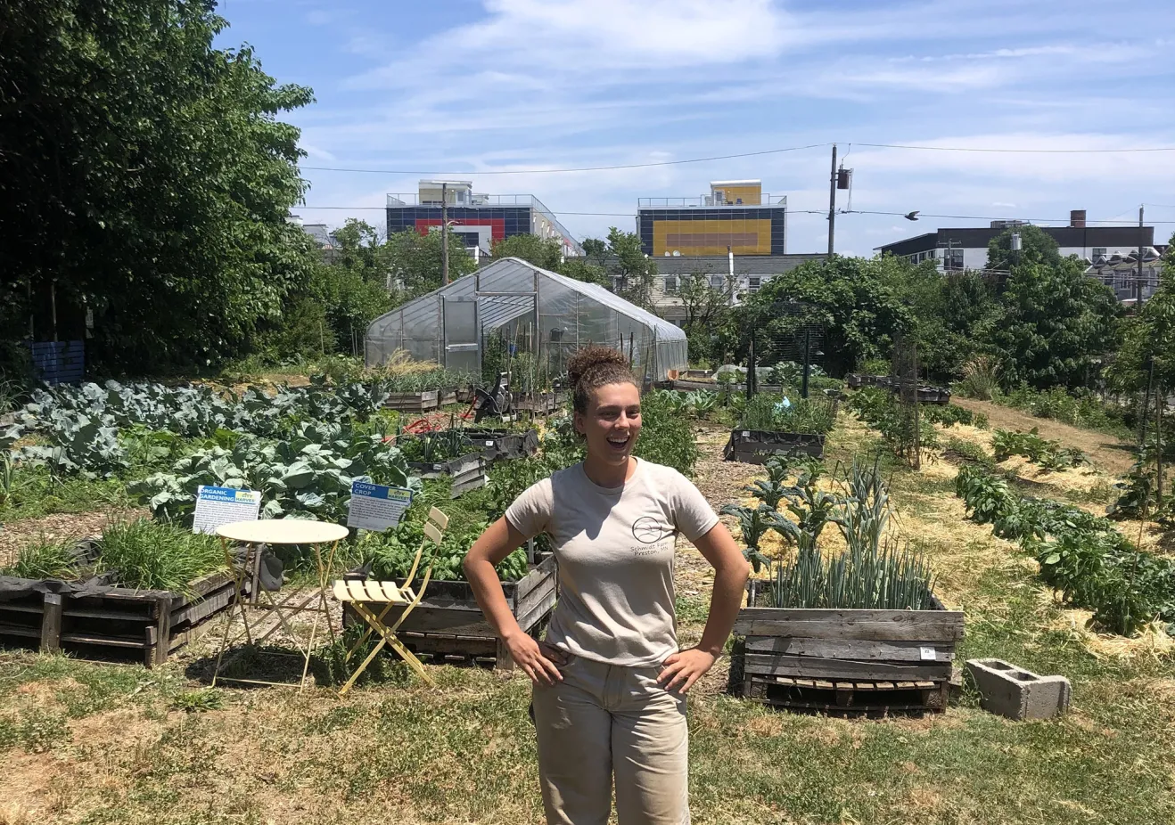An Environmental Studies Alum Stands in an urban farm lab