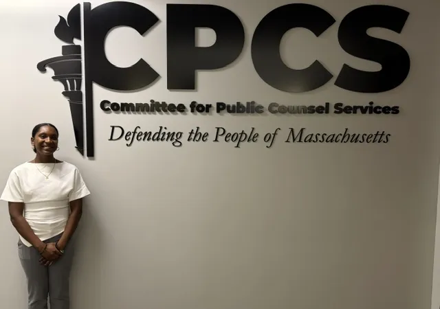 Carina in front of a CPCS sign