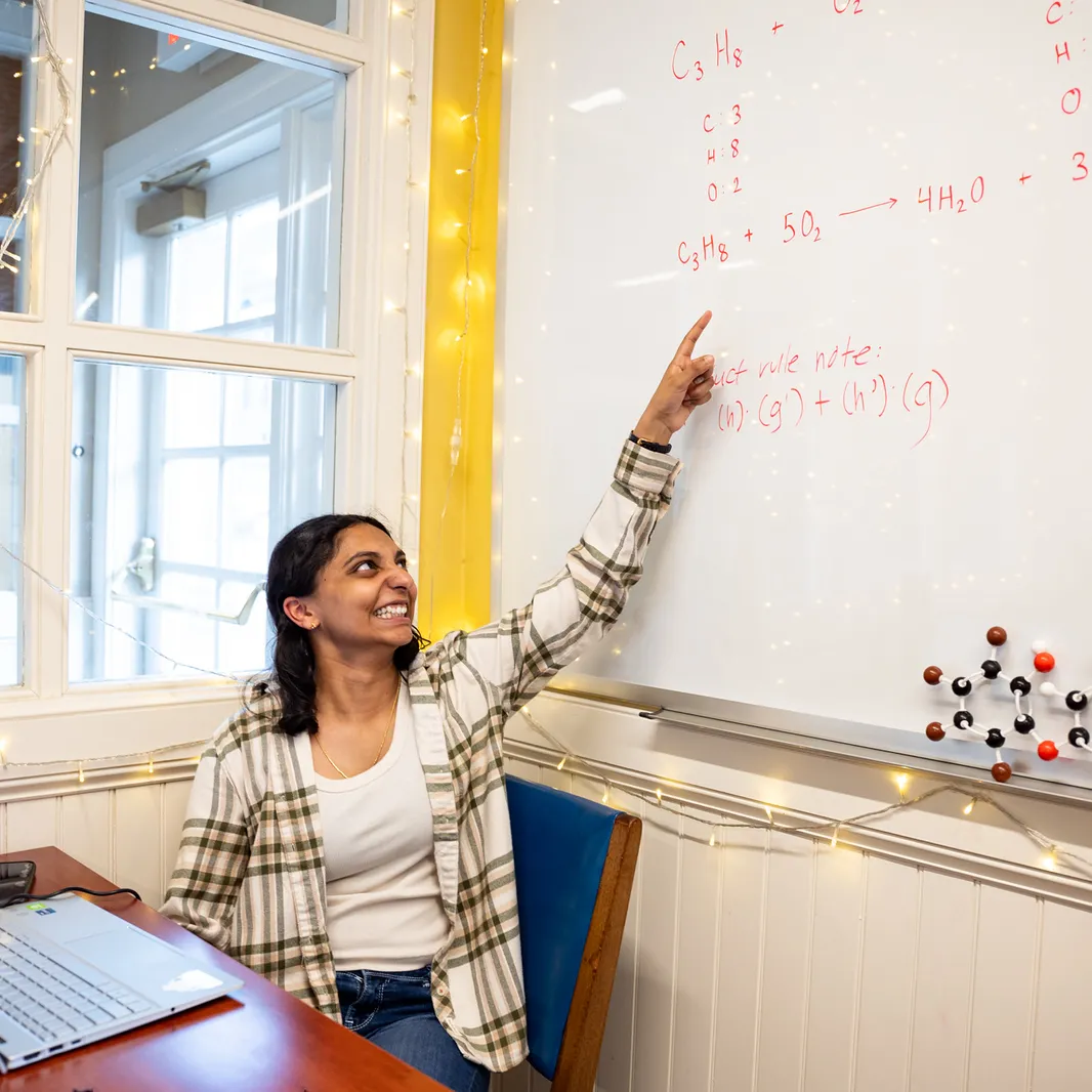 Student at Quantitative Center whiteboard