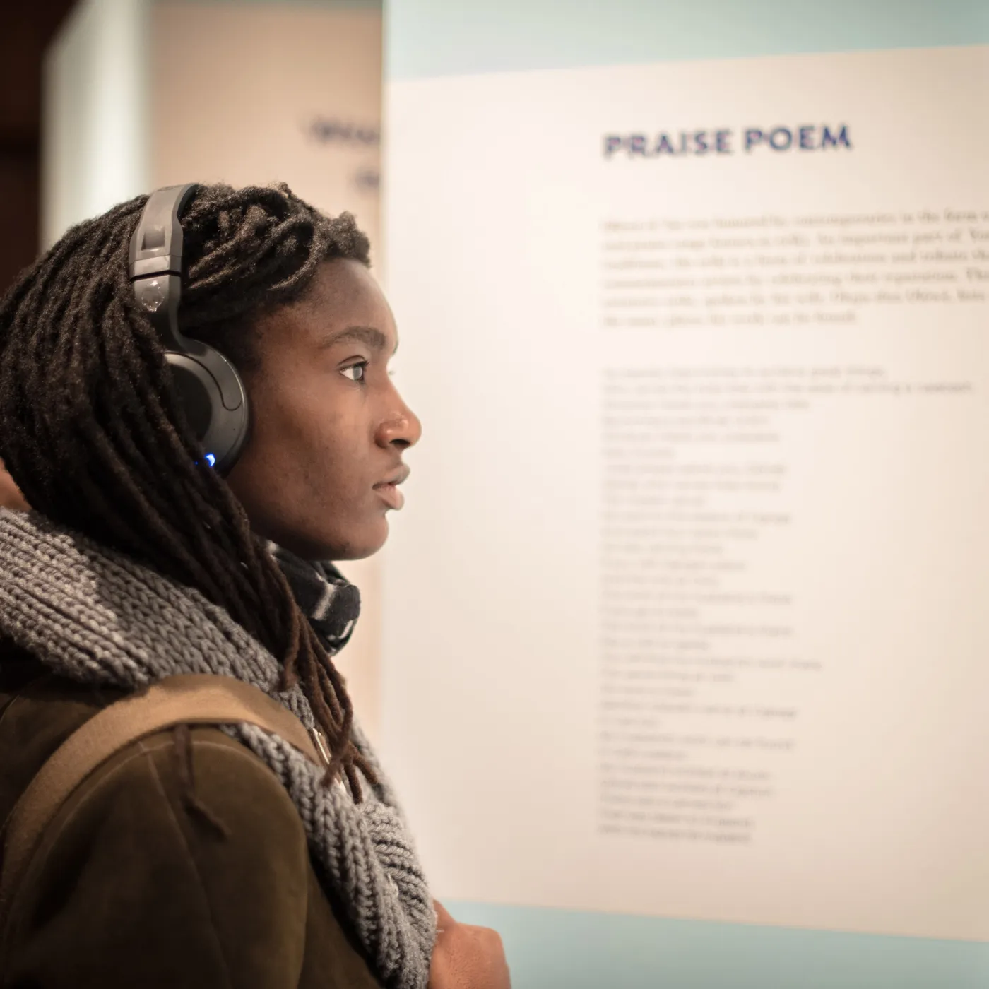 A Bryn Mawr College Student views an African art exhibit curated by Africana Studies students