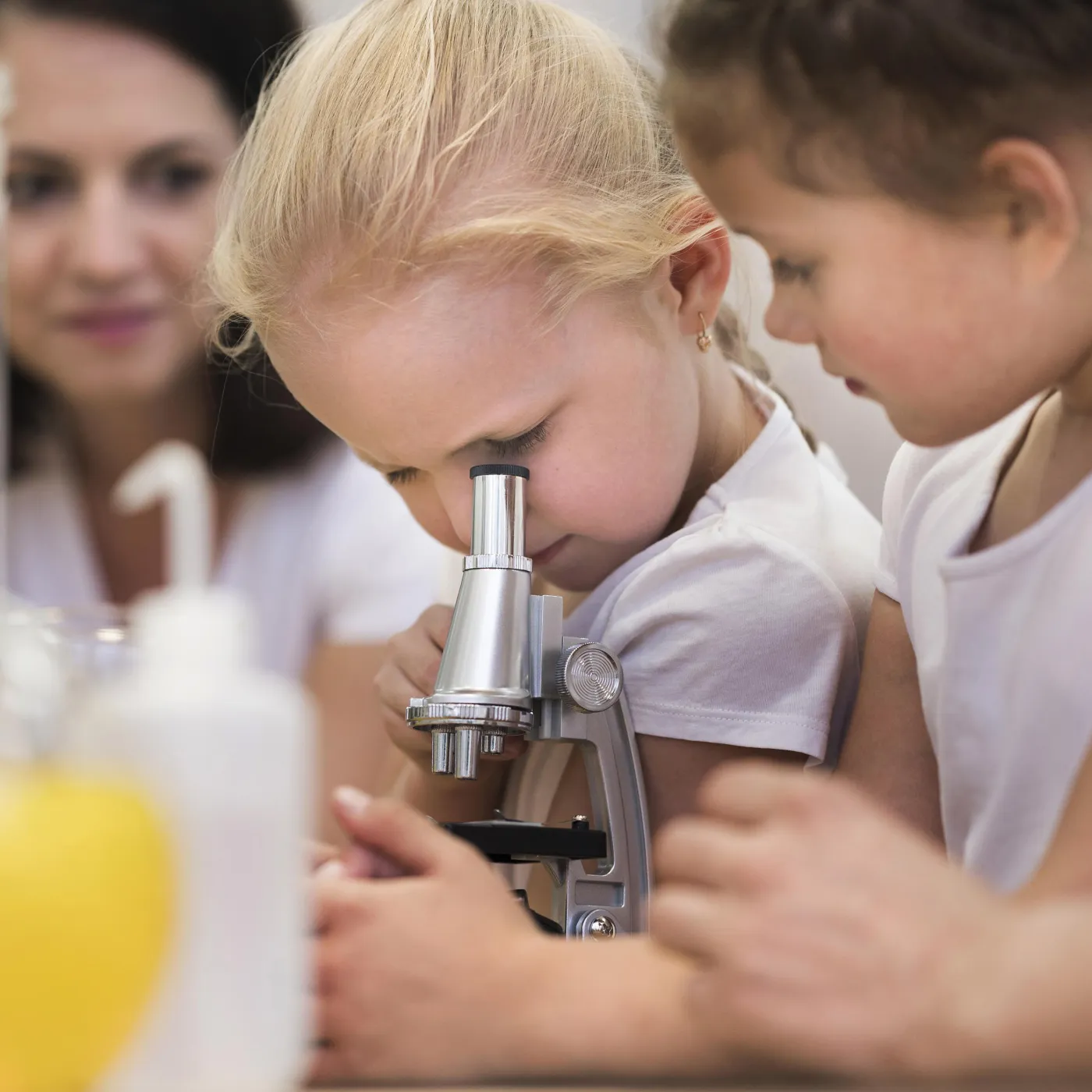Two children do science child and family studies