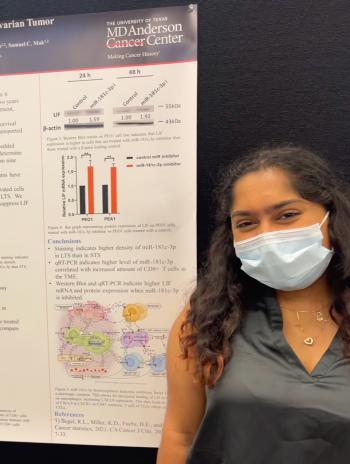 Anam Rawoof in front of her research poster