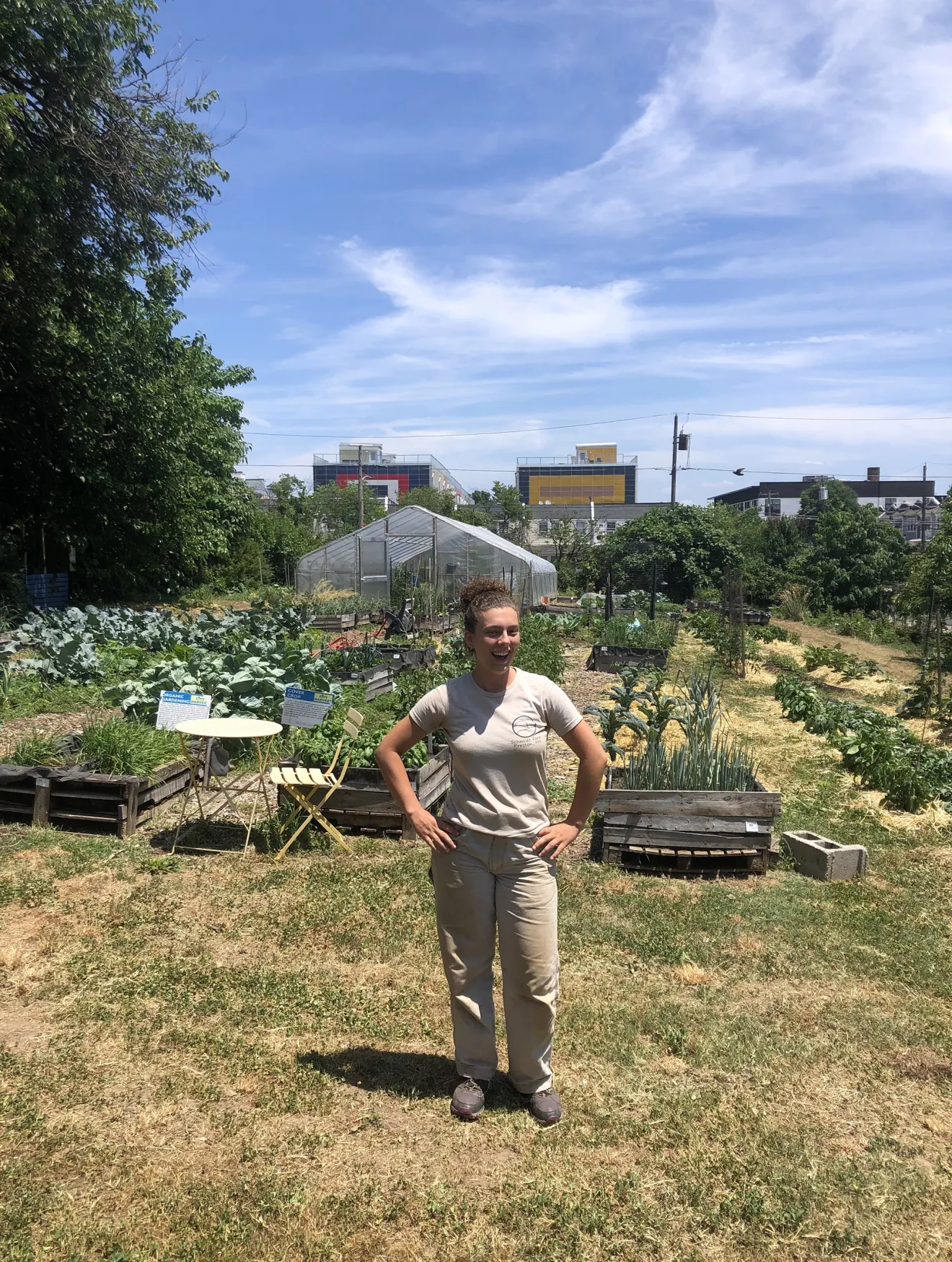 An Environmental Studies Alum Stands in an urban farm lab