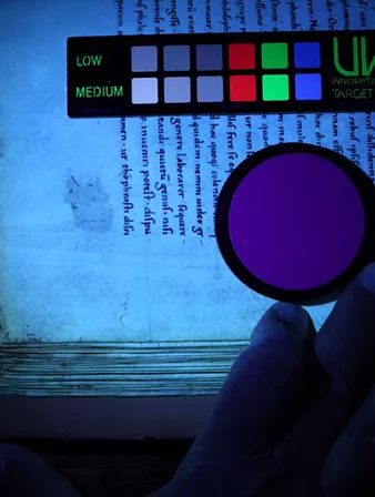 Looking for erased notations on Manuscript #4 using ultraviolet light