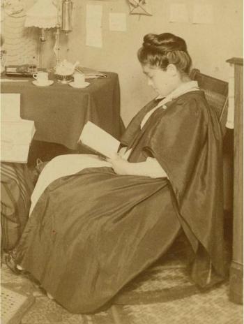 Tsuda Umeko (class of 1890) studying in a dorm room